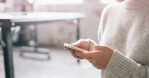Woman looking at her smart phone.