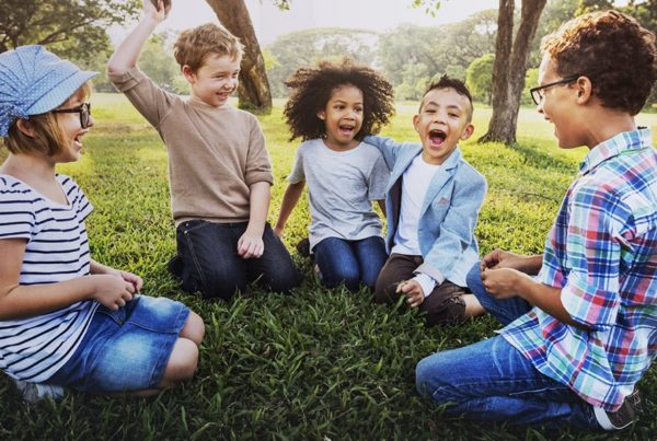 Children playing in grass.