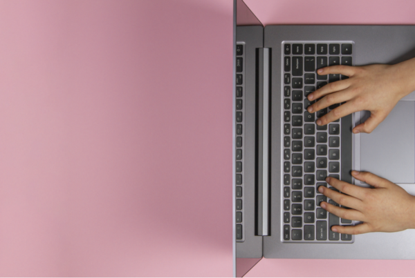 Young child with fingers on computer keyboard.