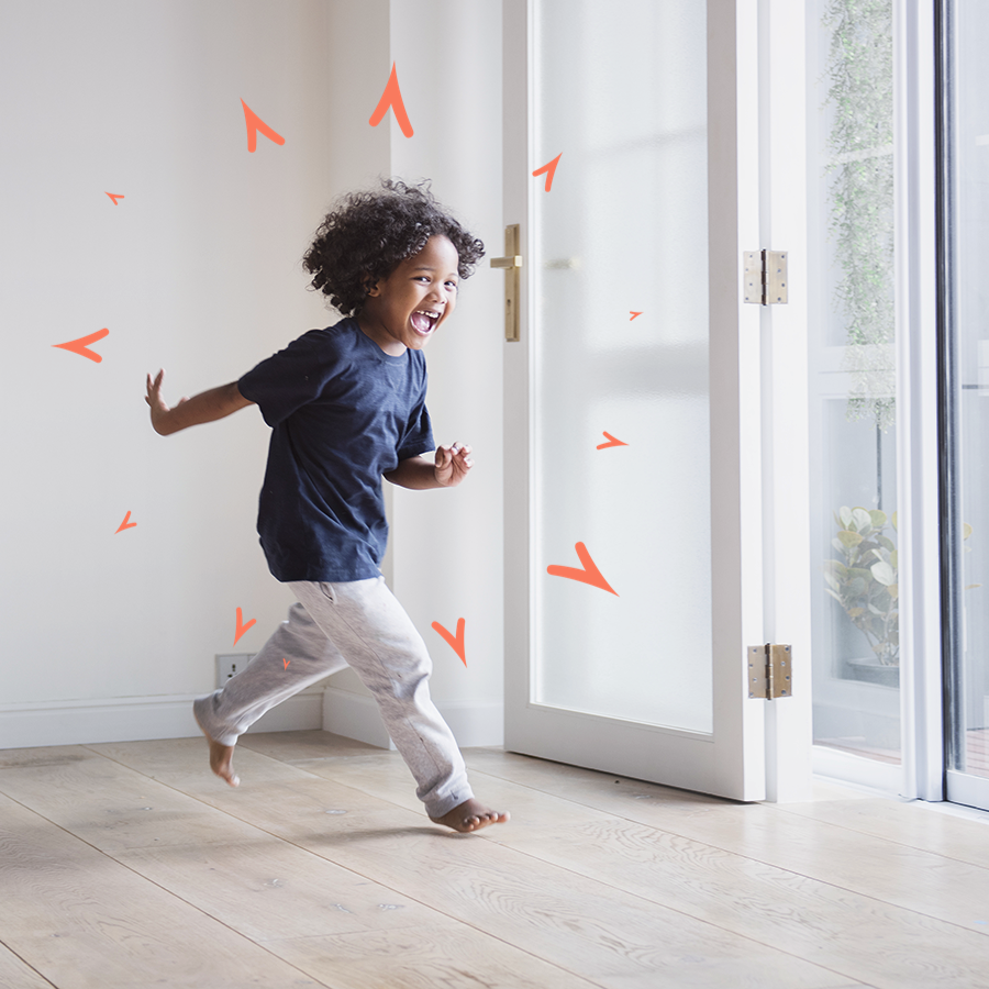 Child running through an open door.