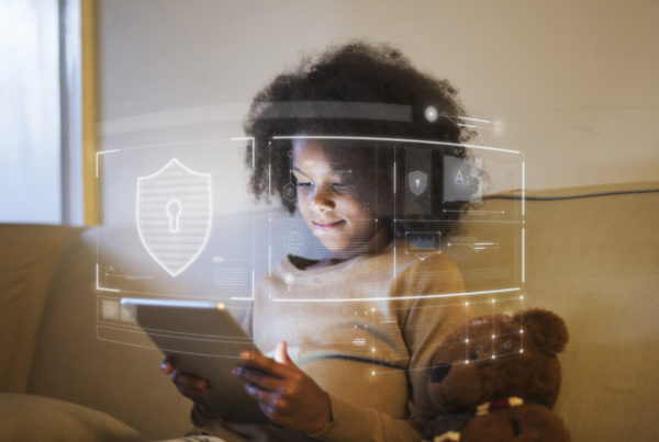Girl holding a tablet with encrypted graphics