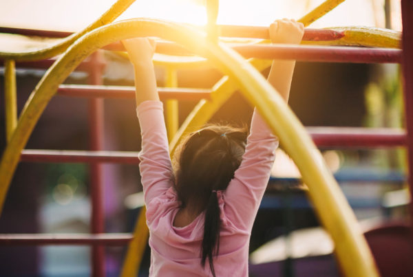 Child on a money bards at a playground.