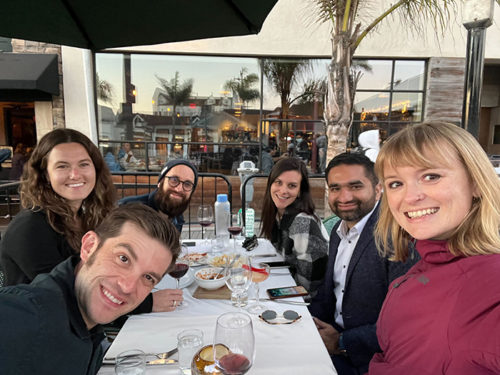 Group of employees enjoying dinner together.