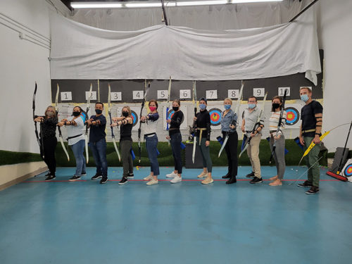 Group of employees at an archery court.