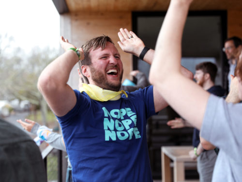 Two employees giving each other hi-fives.