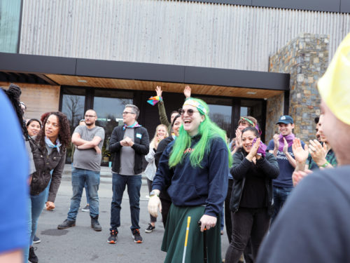 Employees participating in a group activity at an offsite.