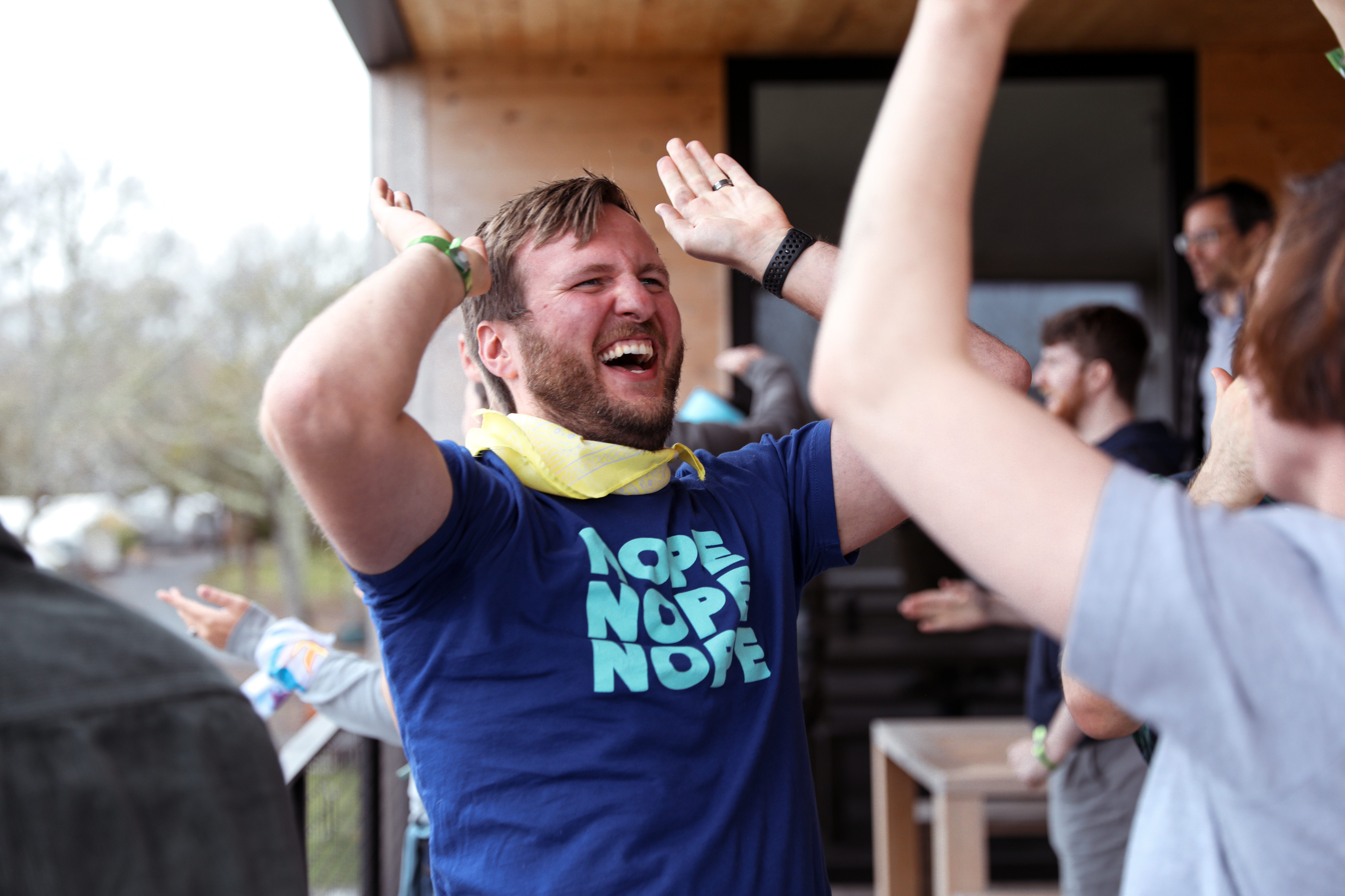 Two employees giving each other hi-fives.