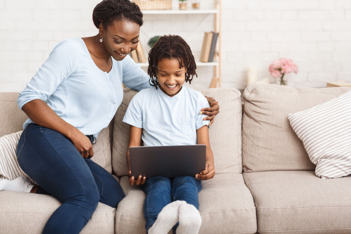 A mother and child using technology together.